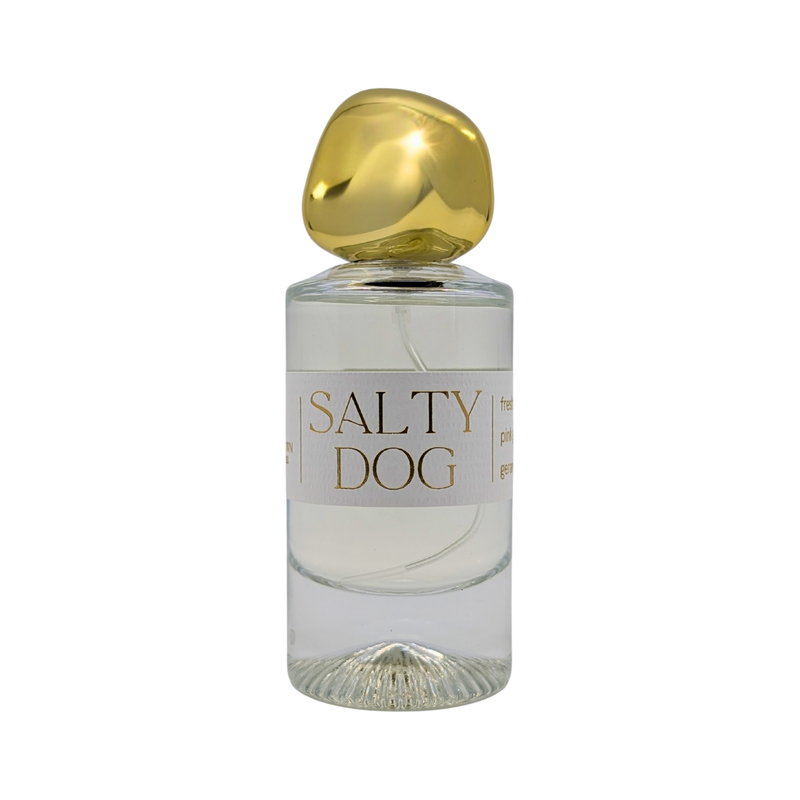 Perfume bottle labeled 'Salty Dog' with a gold cap on a white background